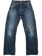 Jean déchiré en lambeaux