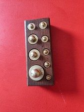 boite de 9 poids en laiton de