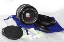 Objectif 35mm f2,4 CARL ZEISS, avec bouchons, filtre, pare-soleil et housse TBE