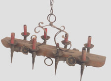 lustre  rustique fonte de fer bras en bois huit bras de lumière  . XX siècle .