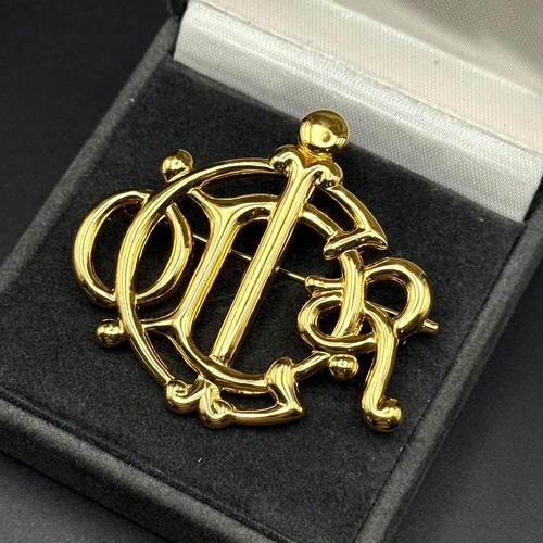Broche christian dior - christian, emblème