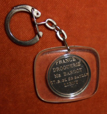 Porte-clés France Droguerie Mr BARDOT 17 R. DE GAULLE LIGNY 55  ( BRIGITTE ?? )