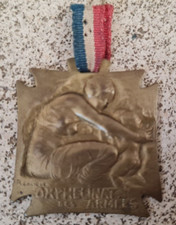 Pendentif médaille signé