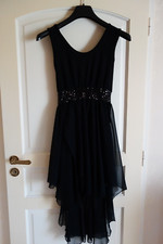 Très belle Robe Cocktail,  noir T 40, ceinturé par un élastique en paillettes, 