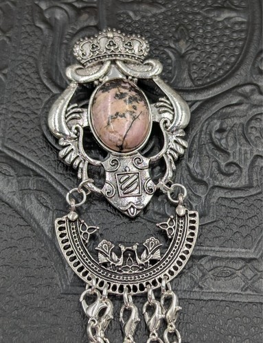 Silver crown and shield crest - and,