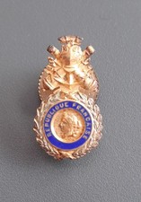 Insigne miniature vis - de, la