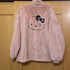 Pull en fausse fourrure rose