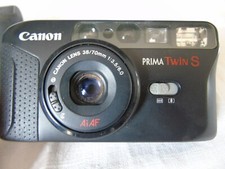 Appareil photo argentique Canon prima Twin S, avec étui. Non testé. Bel état