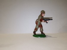 QUIRALU (plastique) militaire tirant mitraillette