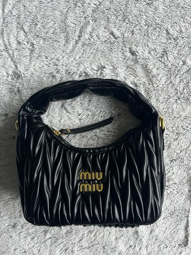 Sac main miu - À,