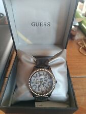 montre guess femme  noir et dorée