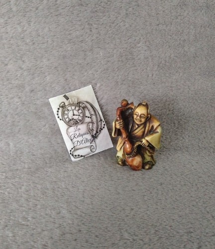 Petite figurine asiatique - , en