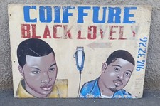 Enseigne de coiffeur ancienne africain. Peinture art populaire d'Afrique 
