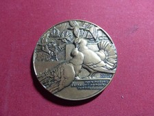 médaille deux pigeons