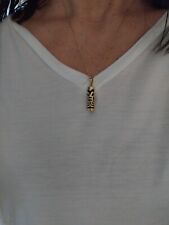 Très beau pendentif ethnique TIKI femme/homme  or 18 carats 750 tête aigle