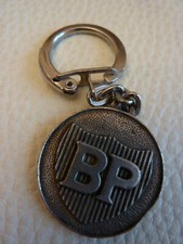 Porte clés vintage en métal logo BP. Tête femme. Keychain. Pétrole énergie 