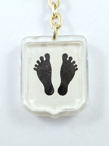 Porte cles pieds noirs - pieds,