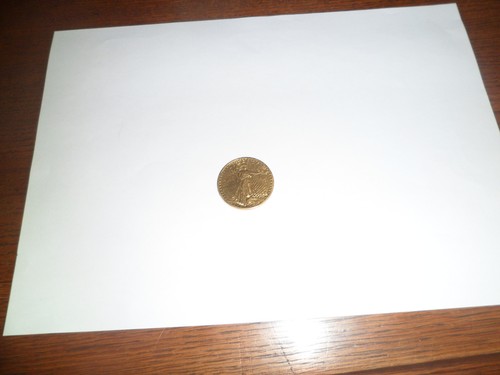 Une piece dollars or - de,