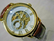 MONTRE MÉCANIQUE  SQUELETTE MIXTE A VISION ARRIERE PROCHE NEUF(à revoir )