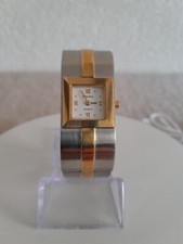 Montre Rodania, quartz, fabrication suisse, couleur or et argent, style art déco