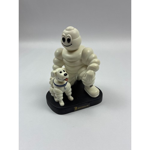Michelin man bibendum with dog - michelin,