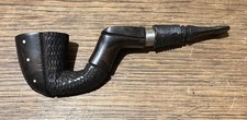 Pipe en bois sculpté