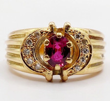 Bague dôme or 18k rubis et diamant dans une monture en demi lunes