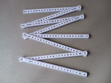 Double mètre pliable pour