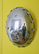 Grand miroir de sorcière à pattes de zinc.