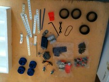 pieces diverses meccano pneu jantes moteur etc
