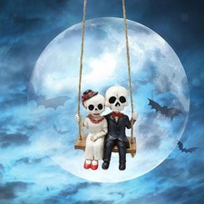 Statue de couple squelette en