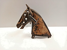 très ancienne tête de cheval en fonte venant d'un ancien jouet, tricycle.....