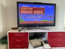 Jeu vidéo Jouet Vintage Console NES Nintendo Boite + Pistolet  elle fonctionne 