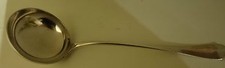 Louche poinconnee en - en, metal