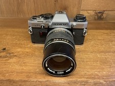 Près De Mint Olympus OM10