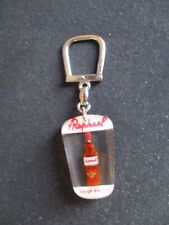 PORTE CLE (KEY RING) BOURBON ST RAPHAEL  BLANC ET ROUGE EXPORT