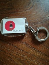 Porte-clés Alcool   DUBONNET, avec calendrier des années 60    p1