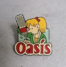 Pin's OASIS boisson à l'orange BD  Franck Margerin 