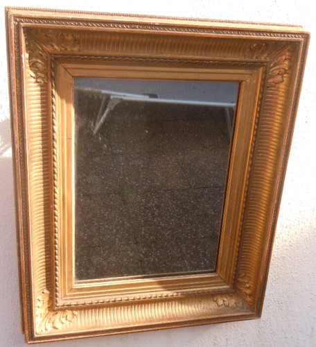 Miroir bois sculpté doré