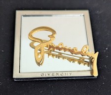 Givenchy broche et miroir de