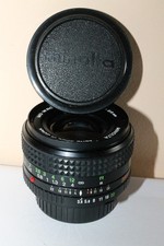 Minolta MD W.Rokkor 28 mm 3,5 + 2 bouchons  + filtre 1A