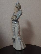 Lladro Company A Woman Holding Puppy