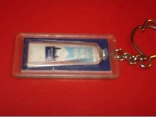 02 : PORTE CLES FIGURINE LAIT