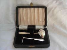 ANTIQUE ENGLISH STERLING BABY SPOON AND FOOD PUSHER,MIDDLE 20th CENTURY.