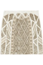 Mini jupe or crêpe ornée