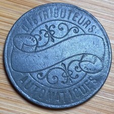 JETON ANCIEN DISTRIBUTEURS AUTOMATIQUES . (1205)