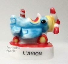 Fève de collection porcelaine / DE LA SERIE LE MANEGE / L'AVION