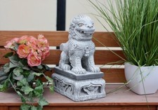 Statuette en pierre lion