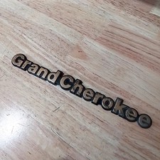 Occasion : Emblème logo "Grand Cherokee"  pour Jeep ZJ, ZG, WJ, WG