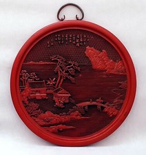 Chinese red lacquered circular landscape with signature